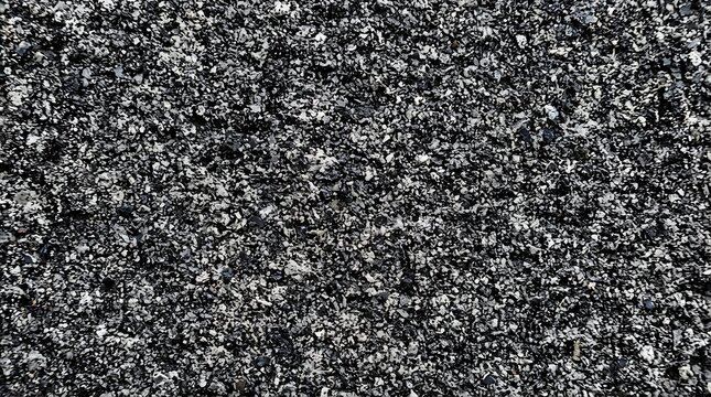 Black asphalt texture background, dark grainy road surface material, rough bitumen stone pavement, industrial construction backdrop