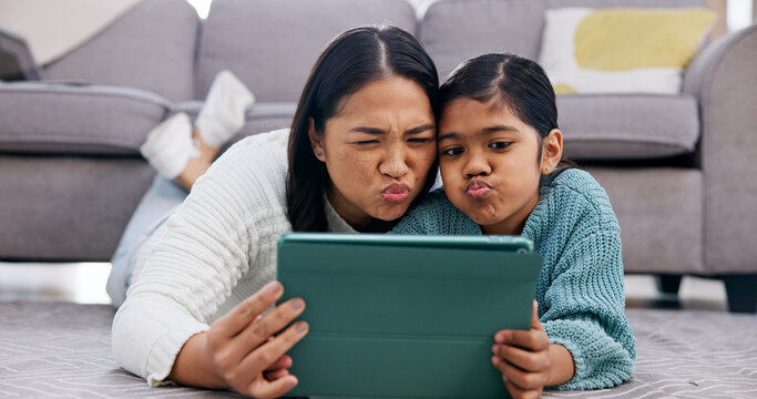 Daughter, mom and selfie with tablet on floor in home living room for bonding or memories. App, funny face and photograph of pouting girl child with single parent woman in apartment for family humor
