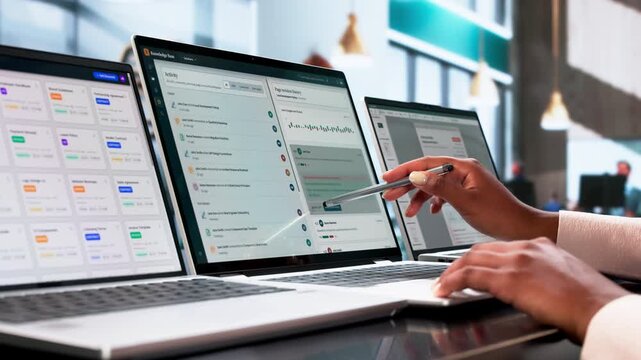 Data Scientist Analyzing AI-powered Knowledge Base On Laptop