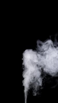 White Smoke Plume Rising. A dense white smoke jet expands into swirling clouds on black. 