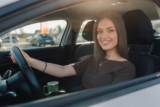 Woman smiling driving car navigating daily commute