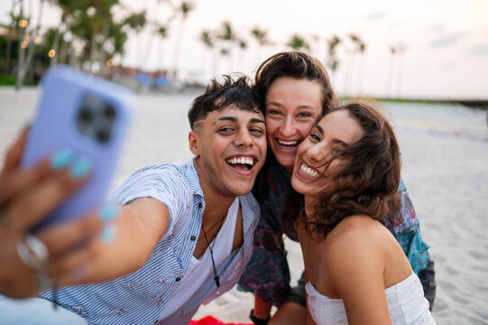 Young adults expressing genuine happiness and the love of life during a sunny holiday