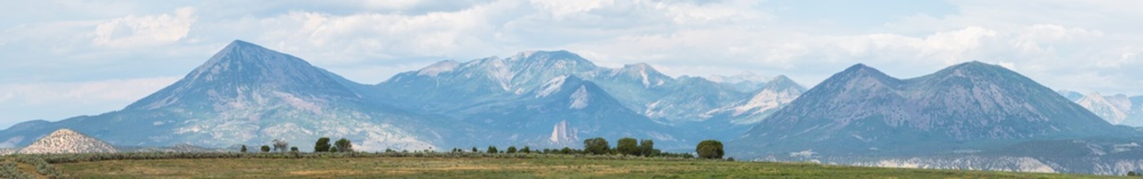 Sweeping panoramic view of a hazy blue mountain range