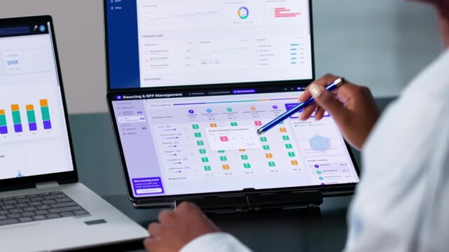 Procurement Manager Reviews Supplier Bids On Laptop