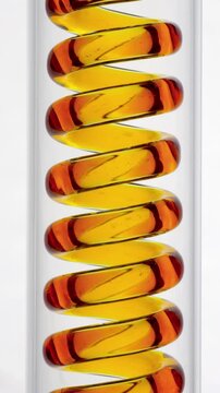 Colored Liquid Flowing Through Spiral Tube. Yellow fluid travels through a transparent coil on a white background.