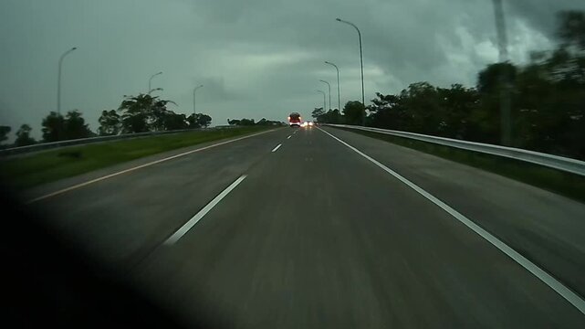 Driving on Ngawi&ndash;Kertosono Toll Road Near Caruban, Madiun, East Java Under Dramatic Cloudy Sky in 4K