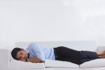 Obraz premium Man sleeping on sofa