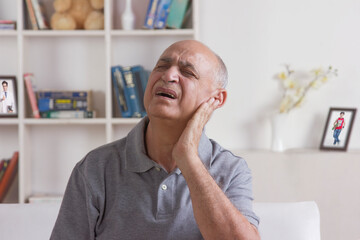Fototapeta premium Old man with pain in ear