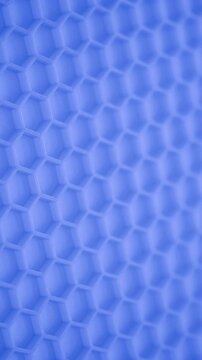 Soft-focus hexagonal cells form a bright abstract background with gentle motion.