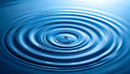 Water ripple effect in blue liquid. © Darni