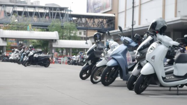 Blurred Defocused Crowded Motorcycle Parking Lot with Trees Outside Urban Shopping Area Street Lifestyle 