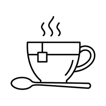 A steaming hot cup of coffee with a spoon on a table indoors.
