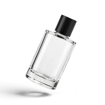Floating clear glass perfume bottle with black cap in bright studio lighting.