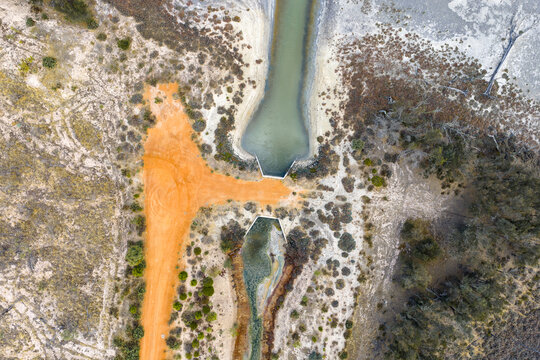 Aerial view of concrete water channel in arid landscape