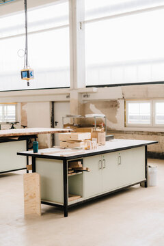 Wooden objects on workbench in carpentry factory