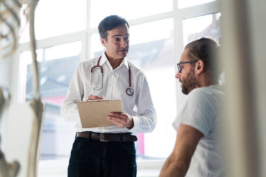 Doctor talking to patient in medical practice