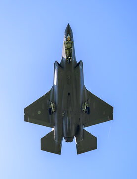 Dutch airforce F35 stealth fighter flies in a clear blue sky