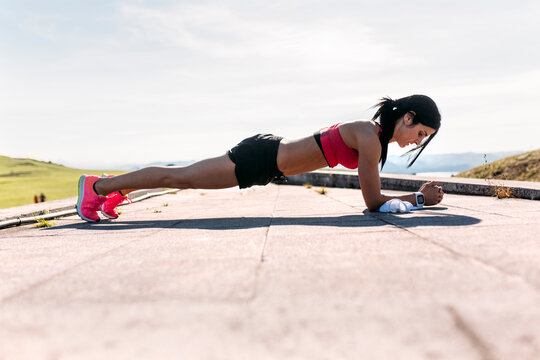 Woman doing push ups, outdoor