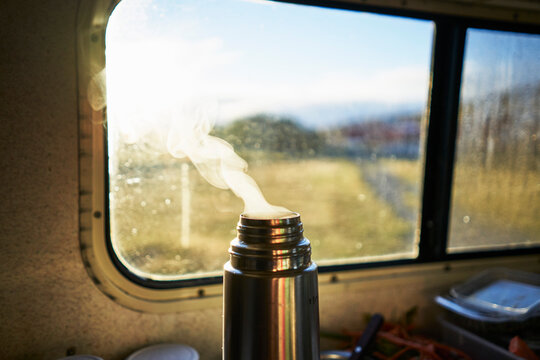 Steaming thermos flask in camper