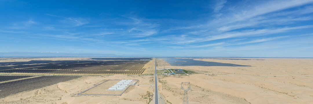 Aerial Panorama of Large-Scale Solar Power Plant with Energy Storage Units Deployed for Desertification Control in Arid Region
