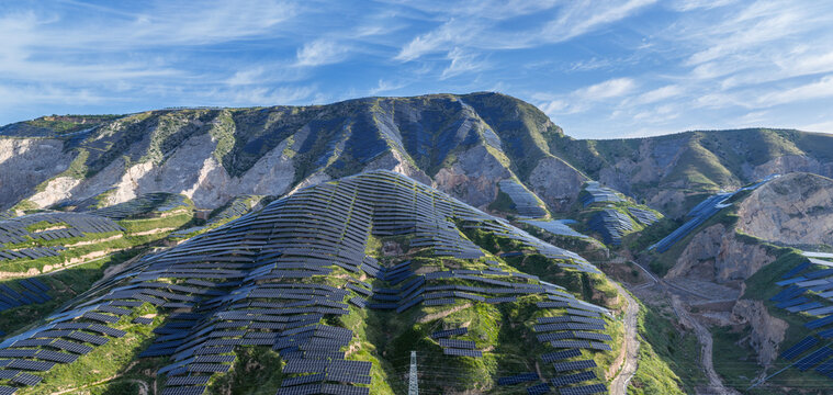 Extensive Photovoltaic Solar Arrays Covering Terraced Mountain Slopes