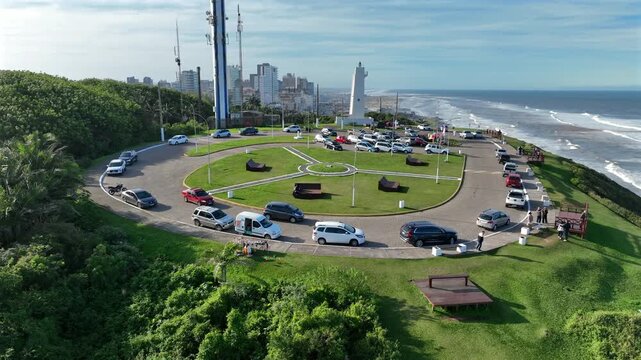 Morro do Farol lighthouse orbit counterclockwise on the Torres coastline in Rio Grande do Sul