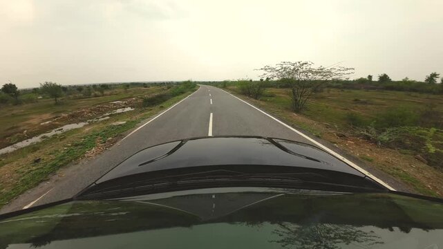 car traversing through countryside area of madhya pradesh india