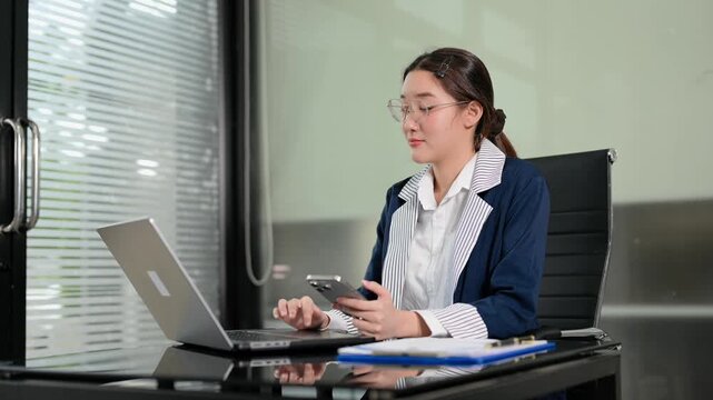 Business woman using tablet and laptop for doing math finance on an office desk, tax, report, accounting, statistics, and analytical research concept in office
