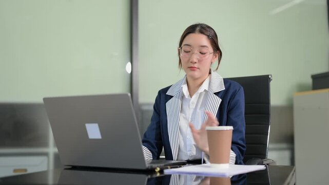 Business woman using tablet and laptop for doing math finance on an office desk, tax, report, accounting, statistics, and analytical research concept in office