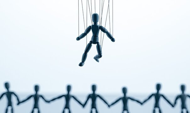A solitary puppet dangles by strings, above a line of joined, dark figures