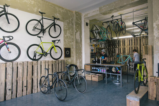 Mechanics working in a custom-made bicycle store