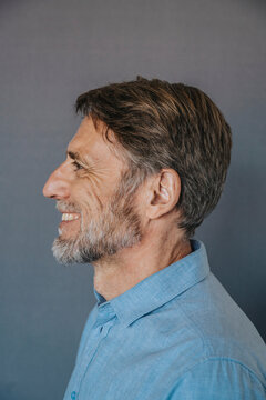 Smiling man over gray background