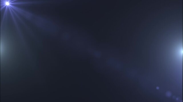 Dark abstract background with soft blue lens flares and glowing light effects, creating a cinematic backdrop with depth, elegance, and atmosphere.