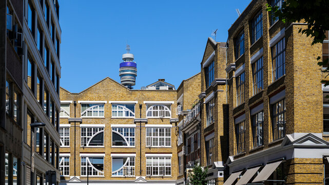 London - 07 15 2022: Stephen Street brick buildings with BT Tower in background