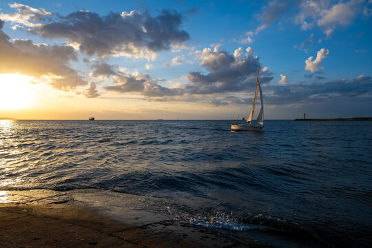 view on sailboat on Baltic sea during sunset in Poland