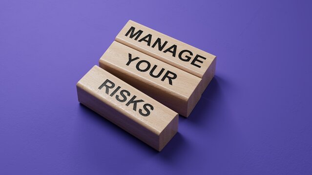 Manage your Risks symbol. Concept words Manage your Risks on wooden blocks. Business and Manage your Risks concept. Copy space.3D rendering
