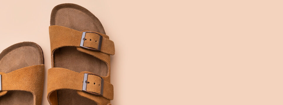Stylish suede sandals in top view feature classic design and neutral tones. Sandals support fashion branding, online catalogs and lifestyle campaigns focused on quality and comfortable wear.