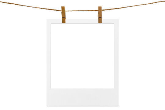 Blank photo frame hanging on a rope with a wooden clothespin. Isolated transparent PNG mockup.