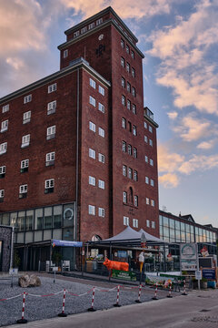 Historic architecture and urban development in Kappeln Germany brick building with modern additions and outdoor cafe european travel german culture