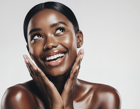 Beautiful Young Black Woman with Radiant Skin Smiling and Looking Upwards