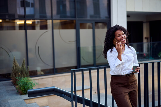 African American Woman on Phone Holding Coffee Outside Office Building Casual Business Lifestyle