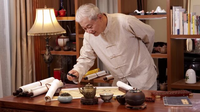 Senior man hands holding magnifying glass to exploring reference checks using ancient scrolls and magnifying glass appraising historical portrait pictures, symbolizing research investigation technique