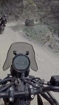 Vertical POV of Adventure Motorcycle Ride on Scenic Himalayan Road in Ladakh