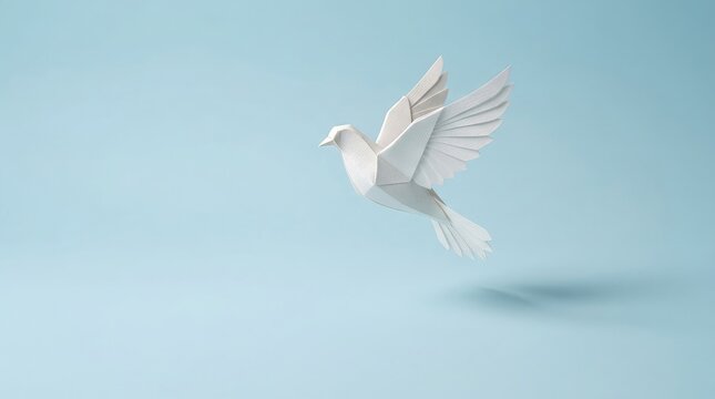  White origami paper dove flying on light blue background with copy space