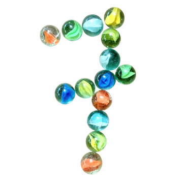 Number seven made of colorful glass marbles