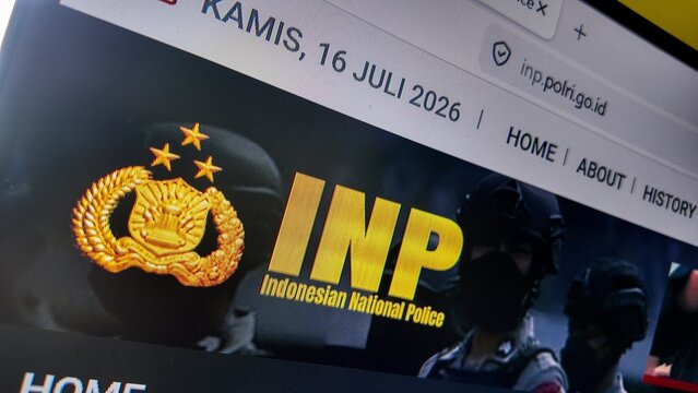 a computer screen with indonesian national police website displayed 