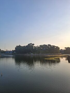 Golden Sunset Reflection Over Tambak Boyo Reservoir, Sleman
