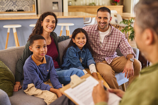 Happy multiethnic family talking with counselor at home
