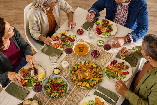Top view of  Generation family having lunch at dining table