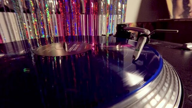 Slow Motion Zoom In on Turntable Stylus and Blue Vinyl Disc